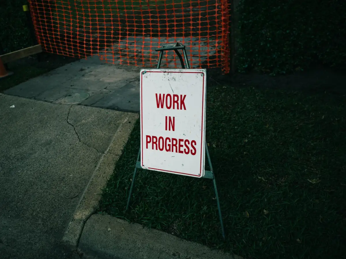 Work in progress sign on a sidewalk section closed for replacement