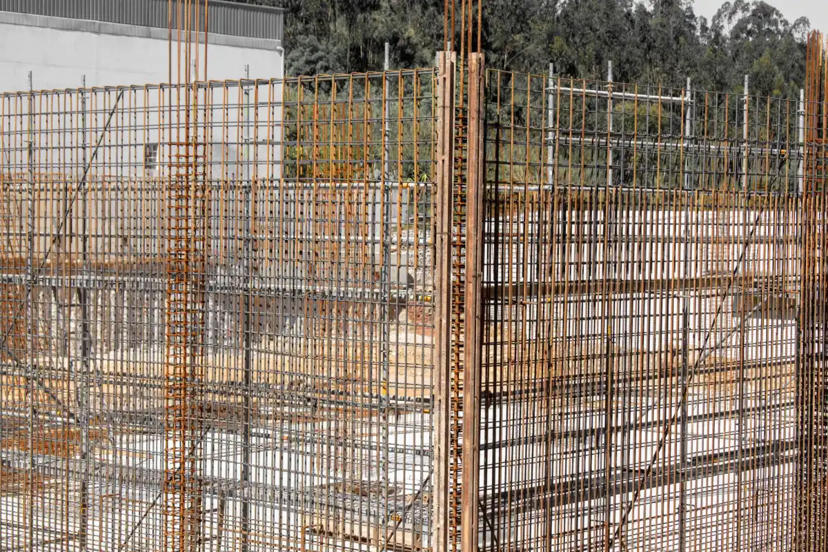 Tied reinforcing steel cage standing ready for a concrete wall pour