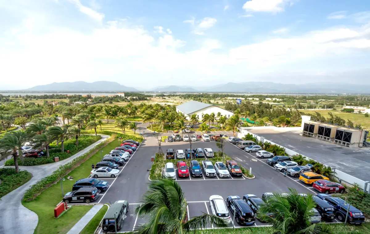 Commercial parking lot with planted islands separating the parking bays