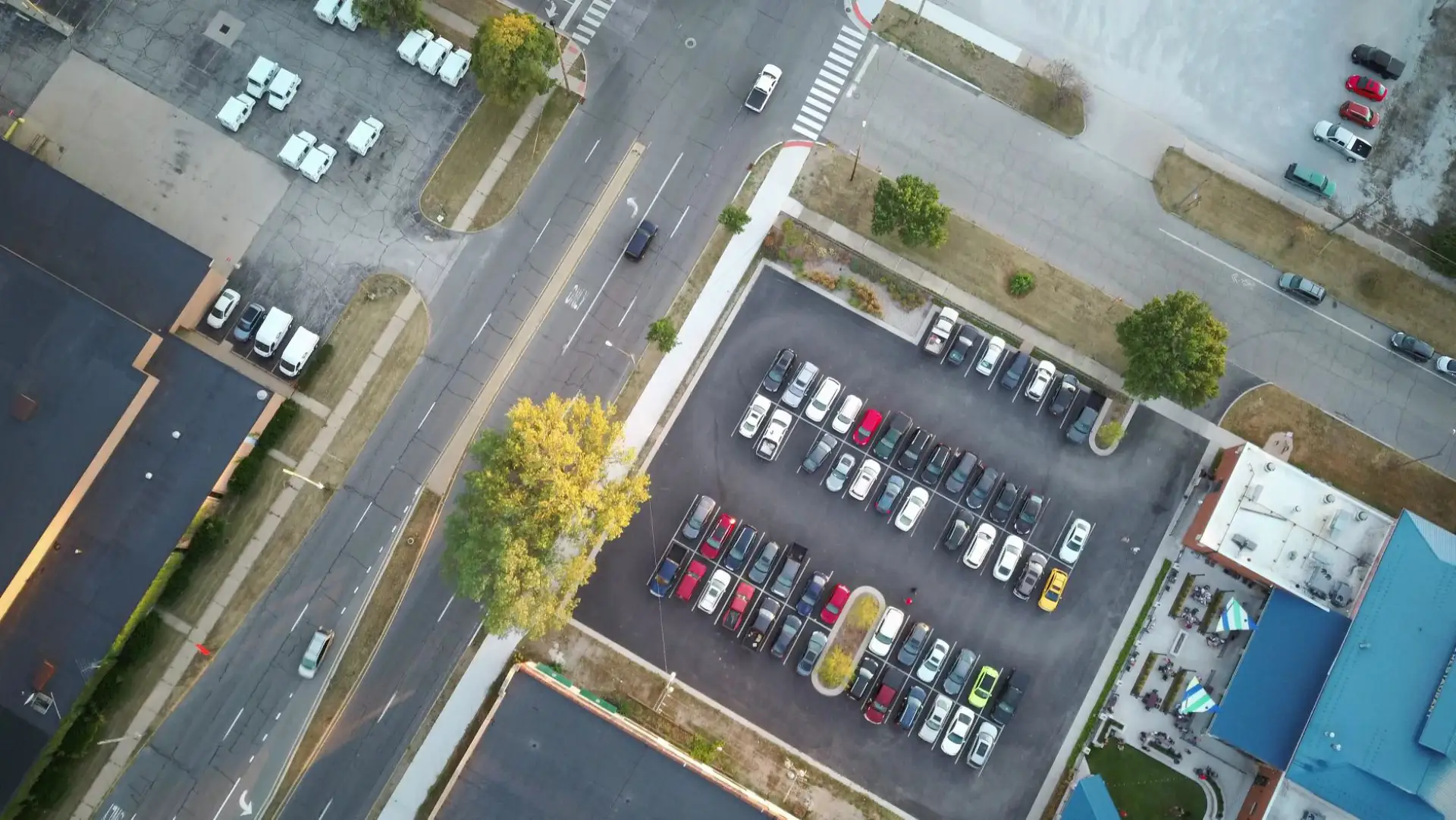 Aerial view of a parking lot and the street serving it