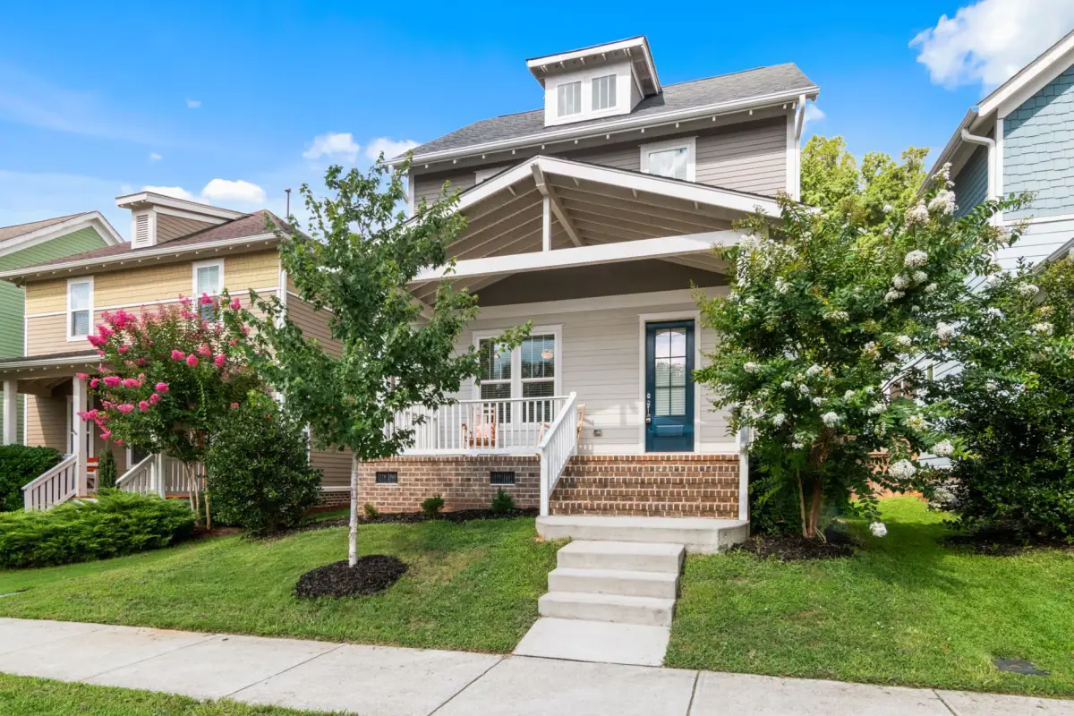 Concrete front walk and entry steps at a two-story house